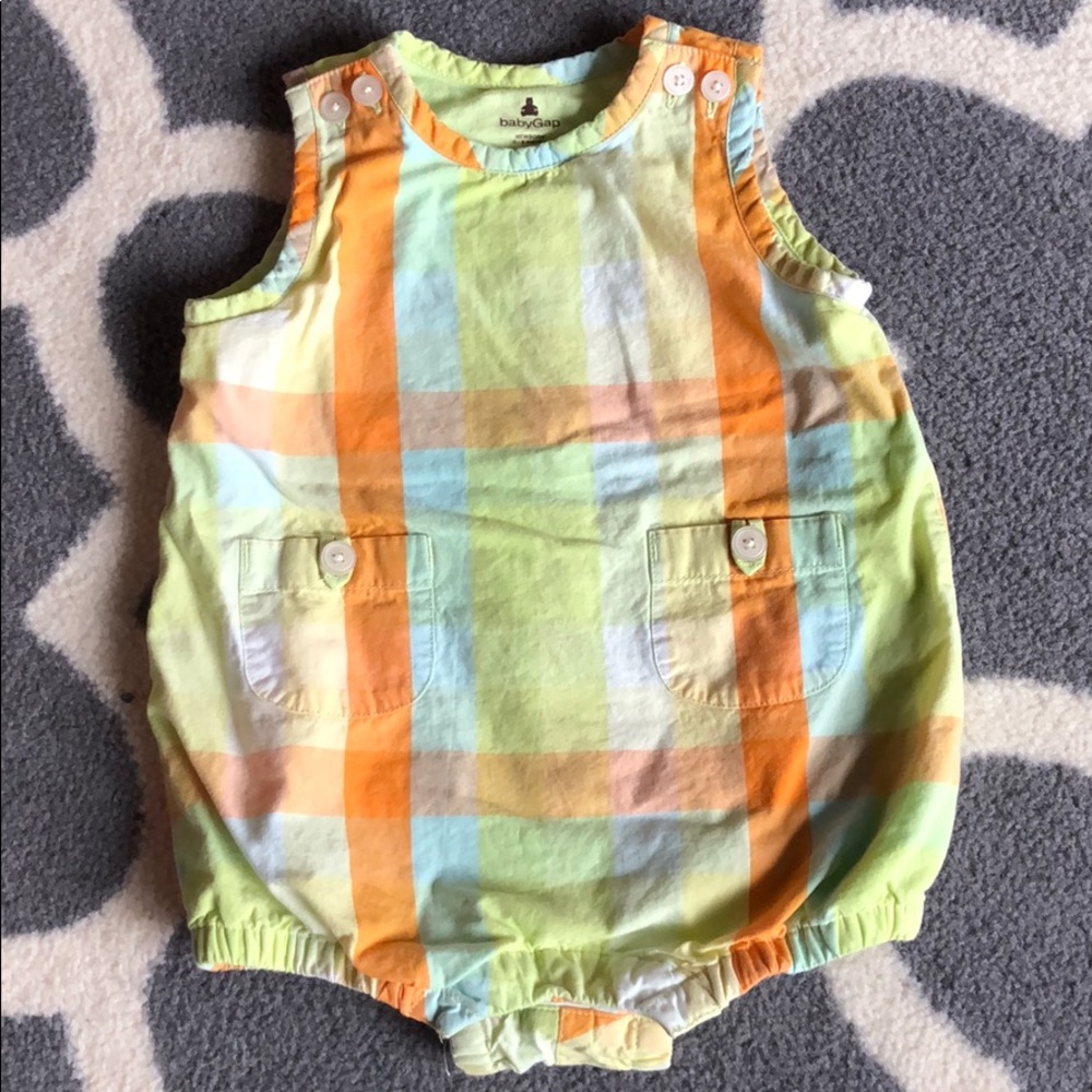 Baby romper with pockets and button detail